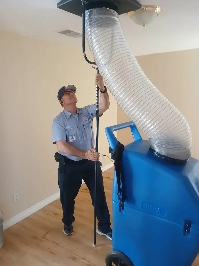 Furnace Tune-Up technician using HEPA equipment in Pembroke Pines